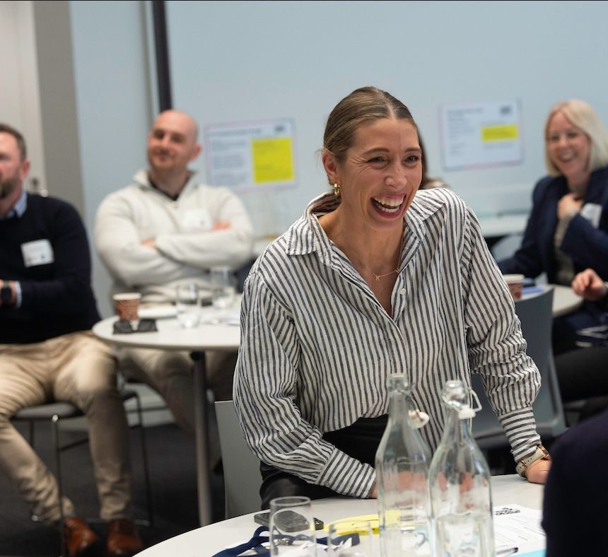 Guests laughing during a co-hosted Straforma Arena